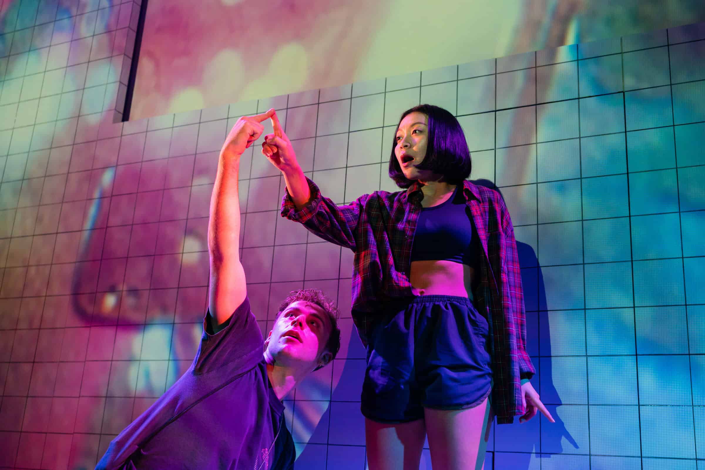 SGTP1993-4 Coco Wang Ling as Candice and Jackson Hurwood as Tony having the tips of their fingers touching like the ET movie